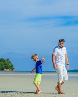 Family on the beach in Thailand.