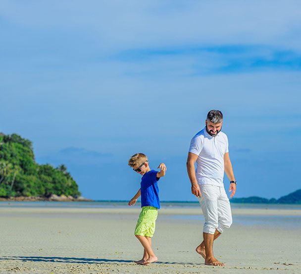 Family on the beach in Thailand.