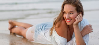 Lady lying on beach.