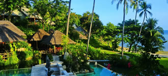 Bungalows nestled in verdant jungle.