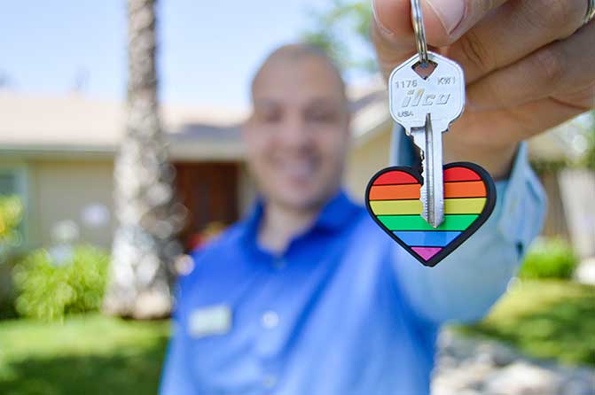 Man holding a house key.