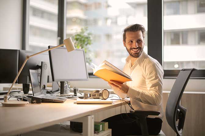 Man sitting at a desk in an office.