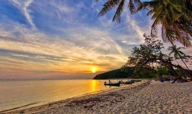 beachfront land with sunset