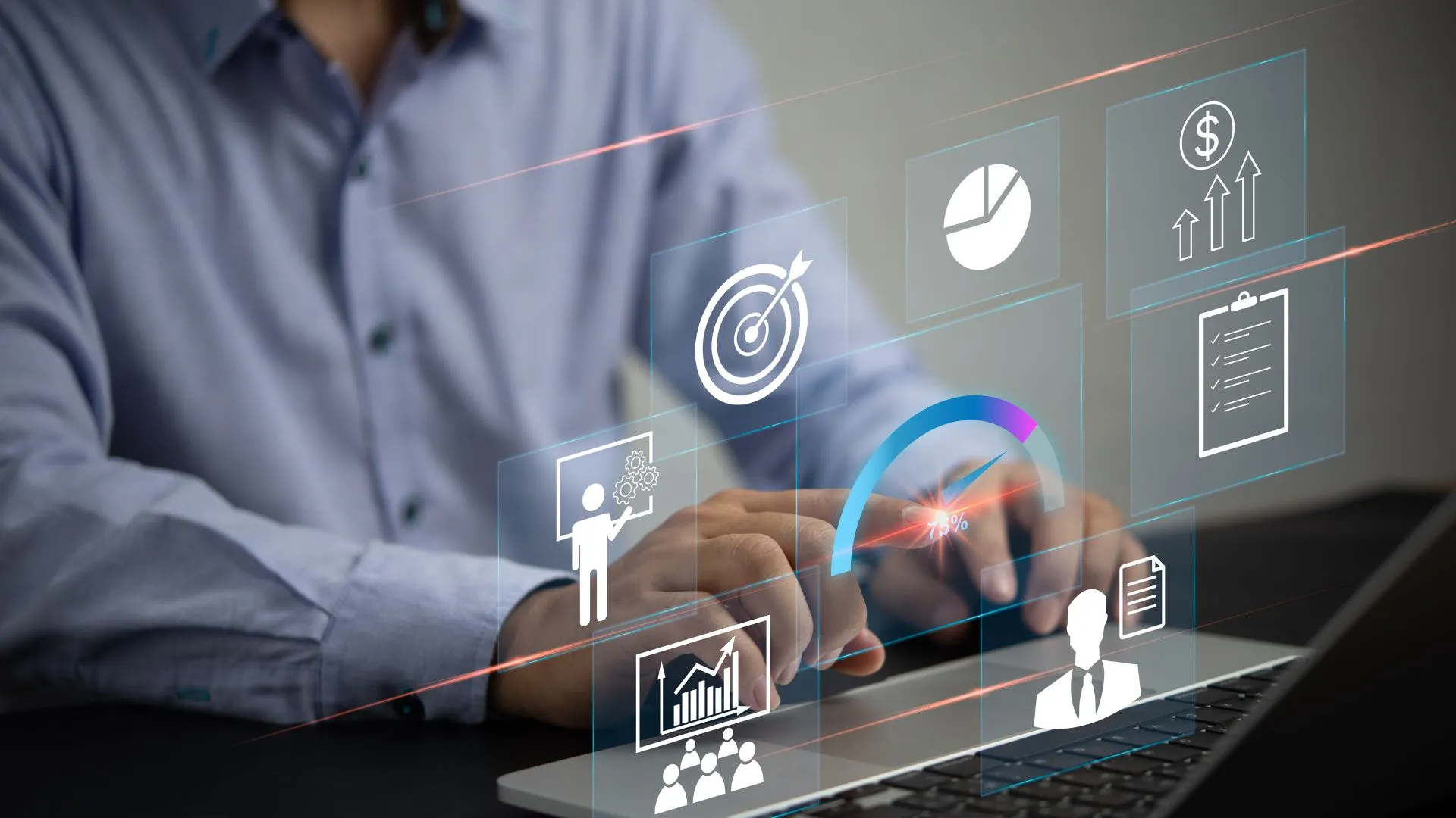 A businessman using a laptop with floating digital analytics icons, including growth charts, target goals, and financial insights.