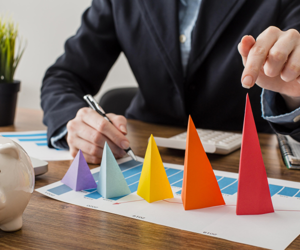 front-view-businessman-with-colorful-cones-representing-growth